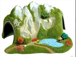 Curved moulded plastic tunnel with added scenery.. 32 x 32 cm 18 cm High. Realistic model scenery trees. Same colour and material as Busch scenery carpet spring green.