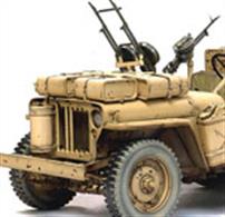 Modelers and collectors were delighted when Dragon released a large-scale 1/6 model of the famous 1/4-Ton 4x4 Truck (Item No. 75020). The kit bedazzled all with its intricate detail and pleasurable assembly, providing modelers with the ideal vehicle to accompany their 1/6 scale figures. Now Dragon is proud to announce a follow-up kit, this time featuring the iconic American 4x4 as a British Desert Raider vehicle. The Special Air Service (SAS) and Long-Range Desert Group (LRDG) widely used this kind of vehicle in North Africa. The SAS, formed in July 1941 by David Stirling, was a commando force designed to operate deep behind enemy lines, something it did very successfully.