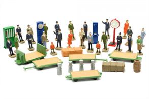 A pack of unpainted station platform accessories including platform trolleys, vending machines, packages, milk churns, railway staff and passenger figures.