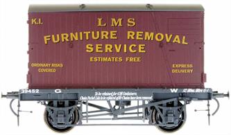 Detailed model of a GWR diagram H7 conflat vacuum brake fitted container wagon numbered 39452 carrying a LMS crimson liveried type B container lettered for furniture removal service.The railway companies expanded their offering through the 1930s with door-to-door removals service using containers which would be transhipped between road lorries and rail flat wagons at each end of the journey.