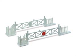 Traditional wooden type level crossing gates complete with the usual adjacent wicket gates for pedestrians. The gates give double track spacing when closed across the tracks