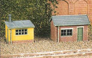 2 huts for shelter and tool storage or with many other uses; platelayers huts, tool stores, lamp huts etc. - even garden/allotment sheds or temporary site huts. Glue and paints required to complete model. Footprint: Brick Hut 28mm x 15mm, Wooden Hut 28mm x 16mm