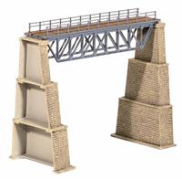 This kit gives you the opportunity to make an interesting bridge for your layout. The design is fairly universal across the world, often found spanning tracks in urban areas or bridging rivers in the country. This style of truss girder bridge is also very common in mountainous regions. Supplied with pre-coloured parts although painting and/or weathering can add realism; glue is required to complete this model. Size: Span 144mm. Trestle: 61mm x 12mm, 125mm Height