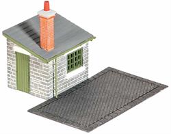 Many goods yards had weigh bridges so that the 'carriage price' of a load to be carried by rail could be costed. Goods were then loaded into the goods shed. Supplied with pre-coloured parts although painting and/or weathering can add realism; glue is required to complete this model. Footprint; Weighing Deck 85mm x 50mm, hut 45mm x 35mm.