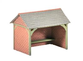 A typical rural bus shelter to add interest to a village or small town scene. Supplied with pre-coloured parts although painting and/or weathering can add realism; glue is required to complete this model. Footprint: 52mm x 35mm.