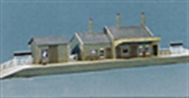 A set of stone built country station buildings based on GWR designs. The main building includes booking office and ladies waiting room with outside gents and an extension to accommodate additional offices for parcels traffic etc. A separate goods store building is supplied, typical of the storage sheds at small stations where a full-sized goods shed would not be required.Total structure size 660 x 121mm