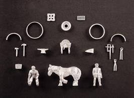 Kit out your forge building with these white metal parts - horse, farrier, grinding wheel and assorted tools. The Wills scenic series provides a range of simple to make kits that help to change your layout into a model railway that contains real life detail.Supplied in white metal, these detailing packs offer an interesting addition to your buidings and scenes. Some assembly is required and painting is necessary.