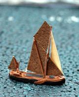 A 1/1250 scale model of a Thames stem head barge under sail by Coastlines Models CL-B02b.Although capable of coastal voyages, these barges could also be found on the Upper Thames and the Thames and Severn Canal. This resin model is under 25mm in length.