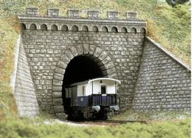 Single track tunnel mouth with 2 stone walls.