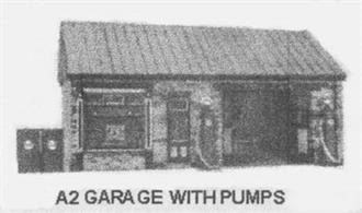Card model kit to construct a typical pre-WW2 roadside garage and car repair workshop with petrol pumps outside.