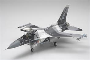 Tamiya 61106  if a 1/48th scale plastic kit of a Lockheed F-16C N Aggressor Fighting Falcon Aircraft, This kit includes the parts needed to construct either the F-16C Block 30, Block 32, Block 42, or F-16N aircraft used by ASAF Aggressor and USN Adversary squadrons. 2 types of main landing gear, air intake, and engine nozzle are included. Brand new parts depicting ACMI pods (2), sensors on the airtake, and, for the first time ever, an AN/ALQ-188 Jamming Pod, all of which ar found on Aggressor/Adversary F-16s. New parts are also included to depict F-16A wheels, which were present on F-16N and early F-16C Block 30 aircraft. 4 types of markings, including 2-tone and 3-tone camouflage patterns are planned.Glue and paints are required to assemble