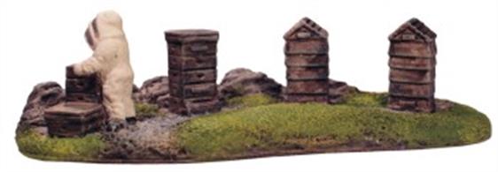 A pack of four beehives and beekepper figure mounted on a scenic base, ideal for quickly creating an interestingï¿½lineside scene.