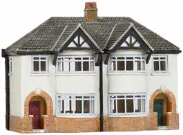 Low relief buildings can be placed along a backscene to improve the illusion of depth to a scene.This building frot is modelled on the new semi-detached houses found in the 1930s suburbs like the famous 'Metroland'.