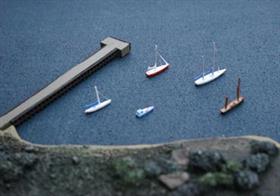 1/1250 scale resin model yachts&nbsp;to populate a small harbour or marina or&nbsp;to anchor off a beach. There are 6 models in a pack, all based on castings of real boats,. The sailing yachts have sails furled and the pack will contain one motor yacht.