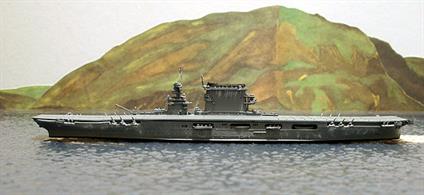 This is a 1/1250 scale model in metal of the USS Lexington, CV2, in 1942, modelled in the condition that she fought and was sunk at the Battle of the Coral Sea. She has just returned to the fleet from a modernisation which should have replaced the 8" deck guns with 5" dual purpose guns, as was done with her sister, USS Saratoga. The 8" were removed but only light AA guns were fitted and she went to sea without the 5" and she was sunk before the 5" guns could be fitted.