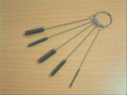 A set of cleaning brushes for cleaning the canals and reservoirs inside airbrushes.