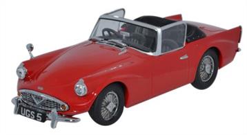 Oxford Diecast 1/43 Daimler SP250 Royal Red DSP002Oxford launched the new 1:43 scale Daimler SP250 (Daimler Dart) earlier this year with its hood in the upright position. Our second release has a celebrity feel to it, being a replica of TV presenter and motoring journalist Quentin Willson's car. It comes as an open topped version with cherished number plate UGS 5 and is painted a superb gloss red. Manufactured by the Daimler Company in Coventry between 1959 and 1964, the SP250 was the last car to be launched by Daimler before its parent company sold the marque to Jaguar Cars in 1960. Originally described as a 2 + 2 sports car, it came with a fibreglass body, either a 4-speed manual or 3-speed automatic gearbox and fitted with a 2.5 litre iron-block V-8 140 hp engine. Our model features a black interior with detailed dashboard instrument panel, automatic transmission gear stick, printed interior door handle and window winder handle and black flooring. The folded hood behind the seats is also black. There is a single driver's side wing mounted mirror. Further attention to authentic detail sees the model with spoked wheel hubs and bumpers with over-riders.