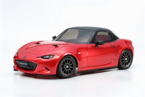 This R/C assembly kit model recreates the 4th generation of the Mazda MX-5 (also known as the Roadster in Japan and the Miata MX-5 in the U.S.), the iconic car with a heritage dating back to 1989 and total sales in excess of 950,000. The dynamic and lightweight car was made to amplify the thrill of driving, with a punchy 1.5-liter (2.0-liter in North American market cars) inline 4-engine and 6-speed transmission, while including modern must-haves such as advanced safety equipment. The Tamiya R/C model faithfully captures the fun and maneuverability of the real life subject as it comes on the proven M-05 M-chassis platform. The M-05 is a simple to build FWD (front wheel drive) machine, which allows for plenty of after-market parts to be outfitted as you grow with your skill. The lightweight, narrow semi-monocoque frame offers an optimized weight distribution and a low center of gravity. A ground-hugging 4-wheel independent double wishbone suspension and a 3-piece steering linkage ensure excellent stability during high-speed cornering. Three wheelbase lengths (210mm, 225mm, 239mm) are possible by simply switching the position of the rear suspension parts, enabling a wide range of body choices available from Tamiya