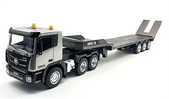 Simulate transporting loads or machinery with this 9ch 1:24 scale truck and flat bed trailer from Huina. With the flat bed mounted separately to the main cab, 270° cab rotation can be achieved for manuovering in tight spaces. The tailgate can be raised and lowered for easy loading. A one press button from the transmitter provides simulated sounds and LED lights on the cab. When unhitched, the flat bed is supported by adjustable front legs, leaving you free to drop your load and return later. Classic truck detailing with interior, wipers, mirrors, treaded rubber tyres and truck wheels, along with diecast alloy parts.