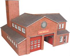 Card construction kit building a modern style fire station structure with a double fire engine garage, side workshop/offices, upstairs mess room and training tower at the rear.