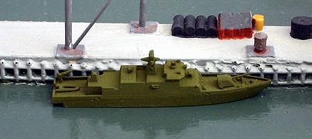 A 1/1250 scale, metal, waterline model of a Finnish missile boat of the Hamina class. There are four boats in this class, built in stages between 1996 and 2006. The main armament is anti-ship missiles but they have an AA capability and can engage multiple aircraft targets. The Hamina class boats are built for stealth, with underwater exhausts having a low heat signature. The model is painted in overall green camouflage.