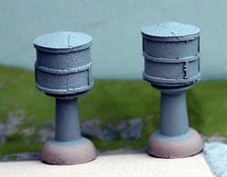 A pack of two pillar-mounted water towers in light grey modelled on some at the Pearl Harbor Naval Base.