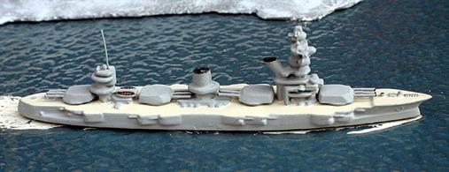 A 1/1250 scale secondhand metal model of the Russian battleship Marat in 1937 by Wiking. The model is in good condition for its age but it has been re-painted in light grey with weathered teak coloured decks. See photograph.