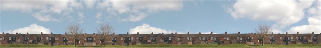 10 feet length 15in high photographic reproduction backscene in two sheets showing a long run of terraced house backs seen behind a hedgerow boundary.Premium backscene printed on glossy paper with self-adhesive backing.Supplied in two 5-foot sections.