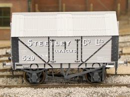 Detailed model of a 7 plank sided covered lime wagon with peaked corrugated iron roof based on RCH 1887 design specifications.Model painted in Steetley company livery with weathered finish.