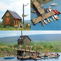 Complete building kit for making a typical boat rental service. Includes many accessories: an office building and wharf (made of genuine wood) rowboats and outboard motorboats, a rubber dingy and air mattresses. The wharf can be built in various configurations. Size of office building: approx. 70 x 48 mm 58 mm high Size of wharf: approx. 350 x 30 mm.