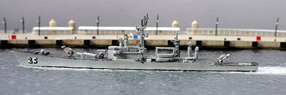 A 1/1250 scale model of USS Bainbridge DLGN 25 by Delphin D26. This model has been re-painted in light grey with dark grey decks and hand-painted pennant numbers, see photograph.