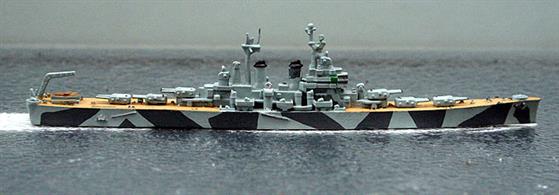 A 1/1250 scale second-hand model of USS Worcester with wood effect painted decks and wearing a camouflage pattern . The casting is by Hansa S90 and the neat painting is by a previous owner by we can find no record of such a pattern ever being applied either to this ship or its sister-ship, Roanoke, see photograph.