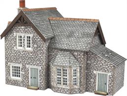 A quaint village cottage with laser cut detailing perfect for any rural scene.