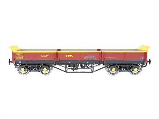 Detailed ready to run O gauge model of BR Turbot bogie ballast wagon DB978255 finished in EWS maroon livery.These wagons were built from vacuum brake equipped Bogie Bolster E wagons to provide a modern, power braked and higher capacity ballast wagon, often used with ballast cleaner trains to carry away waste ballast. The wagons found many other uses, including carrying large boulders to create 'rock armour' sea defences. While replaced in Network Rail service many Turbots continue to serve the permanent way engineers of London Underground and many heritage railways