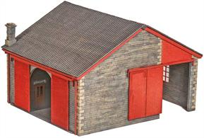 1:120 scale laser cut wood kit with plastic details and glazing sheet constructing a model of a stone built railways goods shed based on the shed at Bovey, South Devon. The doors can be fixed in either open or closed position and the interior features detailed stonework, roof rafters, loading platform and goods office.Length 100mm, width 110mm
