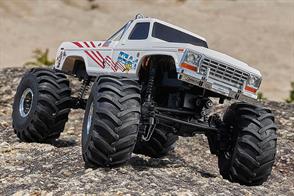 The FMS 1/24 Bigfoot model-MAX SMASHER adopts the FCX24 chassis. The car body design restores the appearance of a first-generation American pickup truck. The huge hollow tires provide excellent shock absorption. The two-speed gearbox, controlled by the third channel, can not only provide strong torque, but also support high-speed off-road driving. The front and rear axles are equipped with planetary gear differentials by default, which is conducive to high-speed off-road driving, posture simulation and outstanding cornering performance. Meanwhile, straight axle parts without differentials are also provided for users to replace by themselves. When the straight axle parts are replaced, the differential function of the front and rear axles is lost but its climbing ability is completely released, and no matter whether it is rocks or mud, it can pass through powerfully. Of course, the hybrid solution of installing a straight axle on the rear axle and installing a differential on the front axle is also an option, which not only enables high-speed off-roading, but also retains a certain climbing ability.FEATURESReady to Run modelTwo speed transmission (controlled by the third channel)Front and rear axle planetary gear differentialsBall bearings full setRemote control lighting systemPortal axleMetal gears steering servoFour link suspensionHigh strength integrated nylon frameRapid separation car bodyPainted bodyOriginal personalized stickersPlated scaled details2.4GHz radio