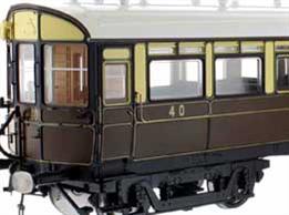 A highly detailed model of the GWR diagram N driving trailer or auto coaches built in 1907 to diagram N numbered 37 to 41. These wood bodied coaches featured the panelled construction of the period which Dapol are faithfully reproducing, along with fully detailed interior including driving cab with controls and saloons with their mix of side bench and cross seating bays. The underframe carries retractable steps, brake fittings and gas reservoirs for the lighting, complemented by detailed reproductions of the GWR 'American' bogies with their prominent drop-equaliser beams.This model is finished in the GWR lined chocolate and cream livery.