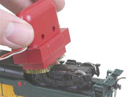 The Speedi Driver Cleaner features dual brass wire brushes with power supply and is wide enough for use with locomotives up to O gauge and can be used with DC and DCC power. The brushes quickly and simply spin the drivers, cleaning dirt from the wheels. This restores electrical pickup and eliminates erratic locomotive performance due to dirty wheel treads. Just clip brush leads any place on running rails or power source.
