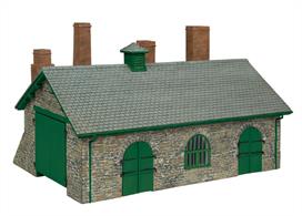 Railways need facilities to maintain their locomotives and rolling stock. Based on the works at Boston Lodge on the Ffestiniog Railway, this Narrow Gauge Blacksmith’s and Wagon Workshop of stone construction with woodwork decorated in green would fit on any OO9 narrow gauge layout. It could also be used as a workshop on a standard gauge OO scale layout.