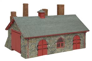 Railways need facilities to maintain their locomotives and rolling stock. Based on the works at Boston Lodge on the Ffestiniog Railway, this Narrow Gauge Blacksmith’s and Wagon Workshop of stone construction with woodwork decorated in red would fit on any OO9 narrow gauge layout. It could also be used as a workshop on a standard gauge OO scale layout.
