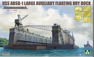 USS Artisan ABSD-1 Large Auxiliary Floating Dry Dock. Auxiliary Floating Dock, Big (AFDB), composed of ten Advance Base Sectional Docks (ABSD) each 165' wide, 93' long, 75' deep, with a total lifting capacity of 90,000–100,000 tons when fully assembled.