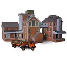 Metcalfe models offer a low-cost range of buildings for the railway and die-cast enthusiast. The quality of these kits really shines through, with high quality printing and imaginative subjects. The kits are supplied in thick card, making for a suprisingly sturdy finished item.A tower style brewery consisting Malt warehouse, Brew house, and a store/distribution depot.Brewing is an interesting process and can use both road and rail transport to supply the raw materials - take away the waste products from animal feeds etc. then ultimately supply the Pubs and Inns of the area with barrels of ale and beer.A great opportunity to lay an extra siding or two on your layout!
