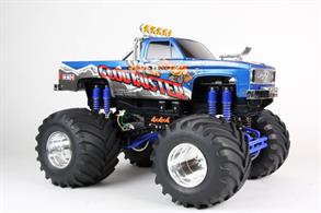 Tamiya 1/10 Super Clodbuster Twin Motor 4WD Monster Truck Kit 58518The Super Clod Buster is back! This monster truck features a body that was inspired by classic pick-up trucks from the 1980's, giving it a realistic appearance. The front grille, air intake and roll bar are recreated with metal-plated parts. The truck also features a twin-motor dual gearbox 4WD drivetrain, 8 coil spring dampers and massive 165mm diameter tires, as well as a 4-wheel drive steering system to help the model navigate tight corners.