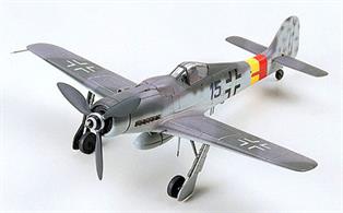 Plastic parts molded in gray and attached to sprues; clear pieces for canopy. Detailed landing gear and wheel wells. Detailed cockpit and instrument panel. Drop tank underneath plane.3-bladed propeller on nose. Engraved panel lines on body and wings of plane. Authentic decals for two aircraft versions. Detailed pictorial instructions.Glue and paints are required