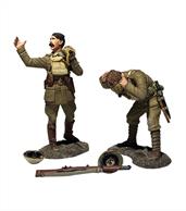 British officer shouting gas warning with soldier putting on gas mask. 5 piece set.Set contains British officer figure shouting while holding his gas mask, soldier figure pulling gas mask over his face, 2 helmets and discarded rifle.