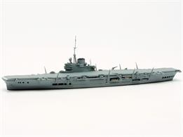 A 1/1250 scale secondhand metal model of the British aircraft carrier, HMS Indomitable by Navis Neptun 1113A. This ship model is in excellent original condition, see photograph and has a large number of aircraft on deck aft.Indomitable was built to a modified design to the Illustrious-class with a double deck hangar towards the stern. On completion in 1941, she was sent to the Caribean to work up but was badly damaged in a grounding and missed accompanying HMS Prince of Wales and HMS Repulse to the Far East. After WW2, she was unable to accommodate jet aircraft in her low hangars and so was in reserve until scrapping.