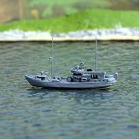 A 1/1250 scale metal model of USS Curlew (ex-Kittiwake), AM69, an ocean minesweeper.