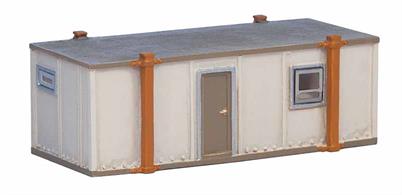 A ready painted cast resin model of a portable site office building