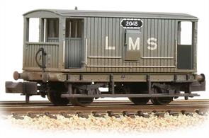 The LMS adopted the final design of Midland Railway guards' brake van as the companys' initial standard design. The cabin provided good accomodation for the guard with the handbrake standard in the centre of the van, easily and quickly accessible, and access verandhs at both ends made boarding easy.While longer than ordinary goods wagons the short brake van did not ride well at the higher speeds which goods trains were attaining in the 1930s and this design was replaced by long wheelbase vans, but with several thousand of these brake vans in service many remained in us into the 1960s.This model is painted in the early LMS grey livery.Era 3 1923-1947