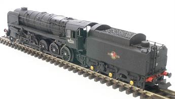 Detailed model of British Railways class 9F 2-10-0 heavy goods locomotive 92214 finished in as preserved BR lined green livery with later lion holding wheel crests.The Dapol model features a tender-mounted motor with drive shaft powering the locomotive driving wheels, allowing more weight to be added to make the locomotive capable of hauling long goods trains.